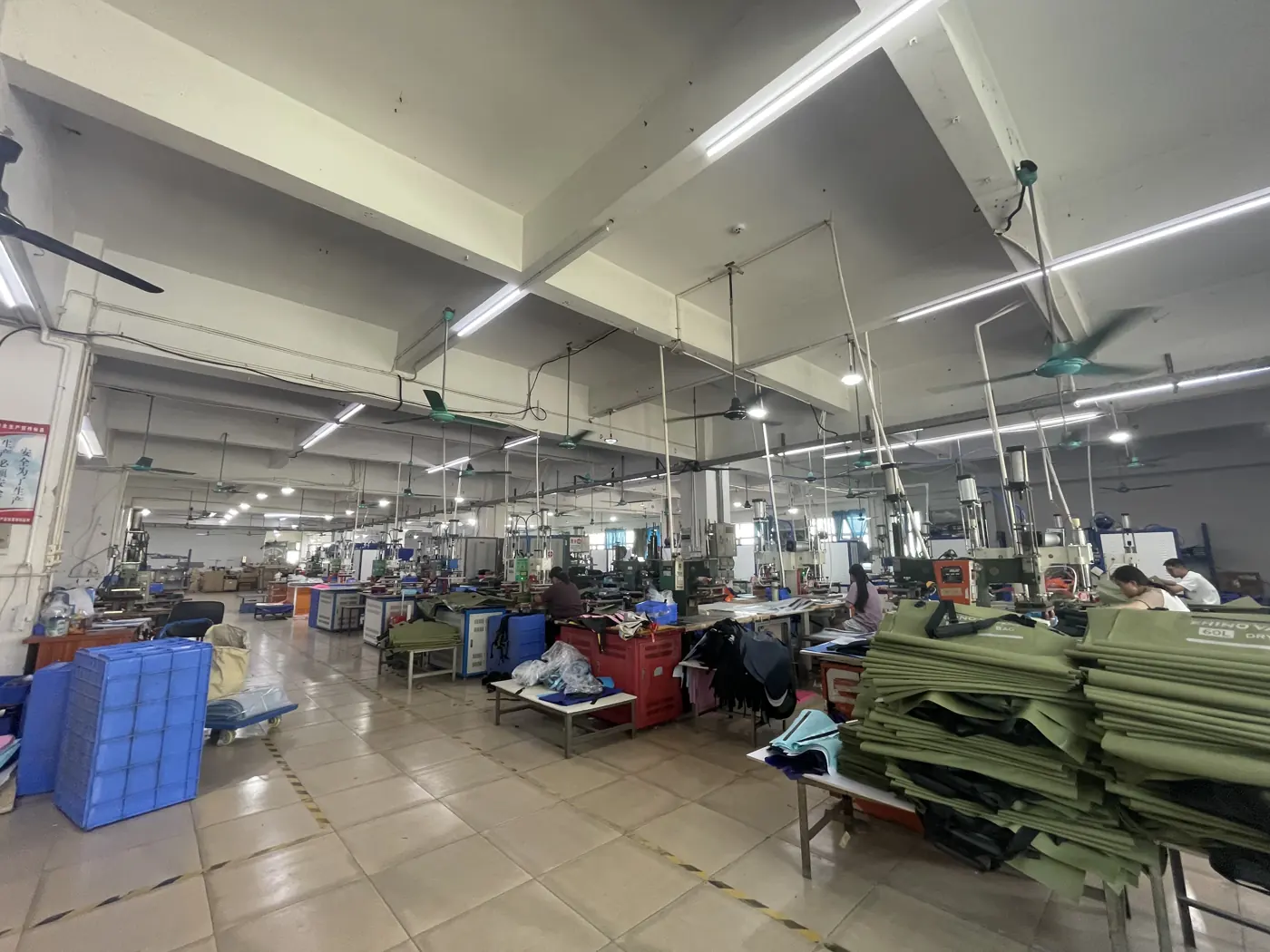 Workstations and material staging in Outdoorsbloom's Dongguan workshop