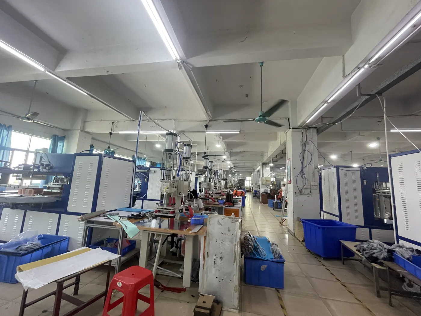 Production worktables and equipment layout at the Outdoorsbloom workshop in Dongguan