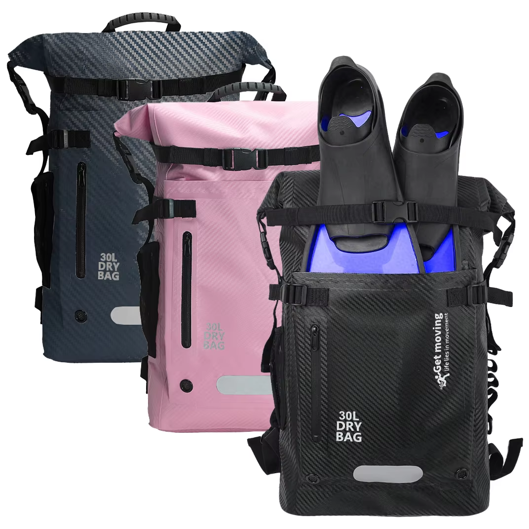 Dark grey, pink and black fin-storage dry backpacks with purple fins in the front pocket