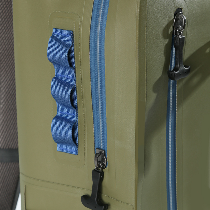 Blue zipper and external webbing detail on TPU dry backpack