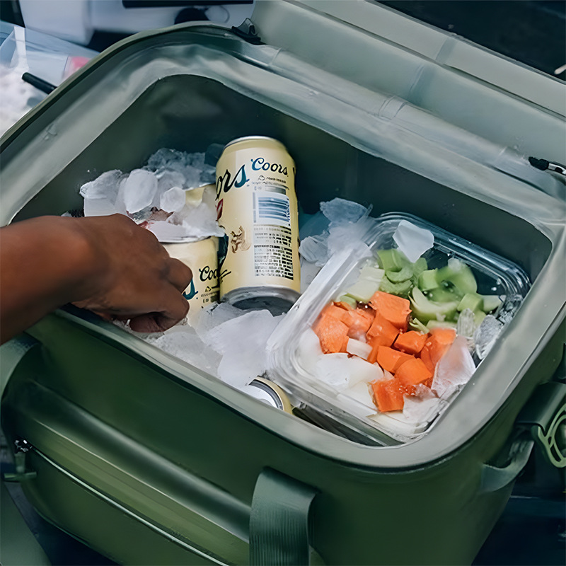Insulated cooler shown with drinks, ice and picnic items